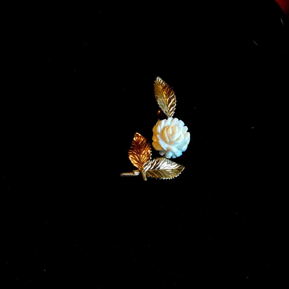 Rose pin genuine ivory 14 kt gold overlay.